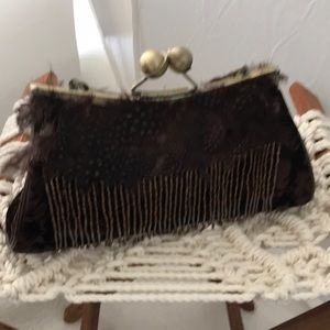 Velvet handbag with feathers and tassles